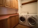 Laundry room with complimentary detergent and dryer sheets